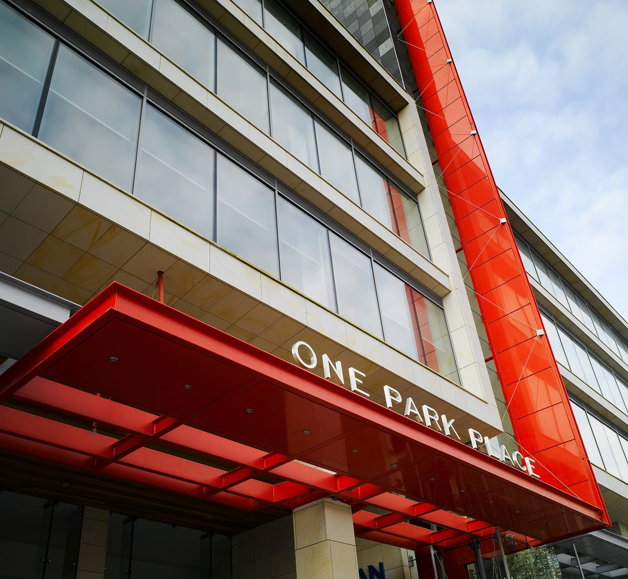 Exterior building logo for One Park Place.