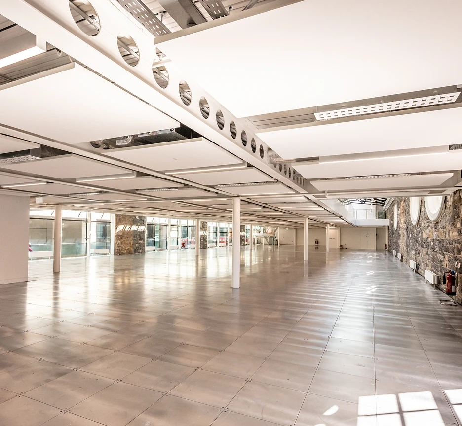 Empty floorspace with pillars in the middle of the floor.