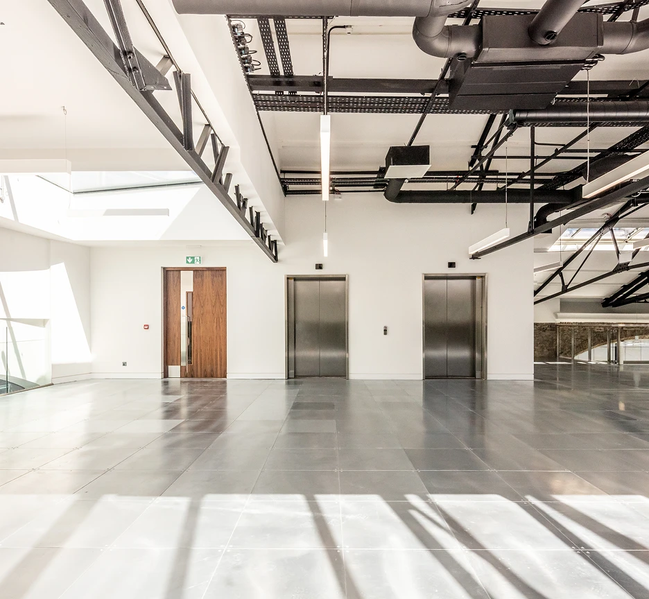 Two lift doors and an emergency exit door.