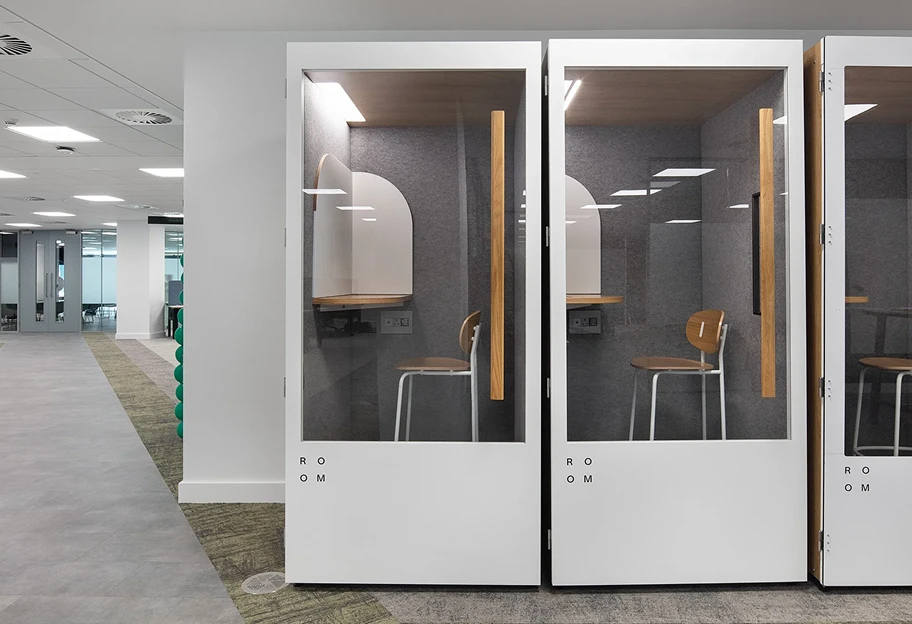 A line of white meeting pods.