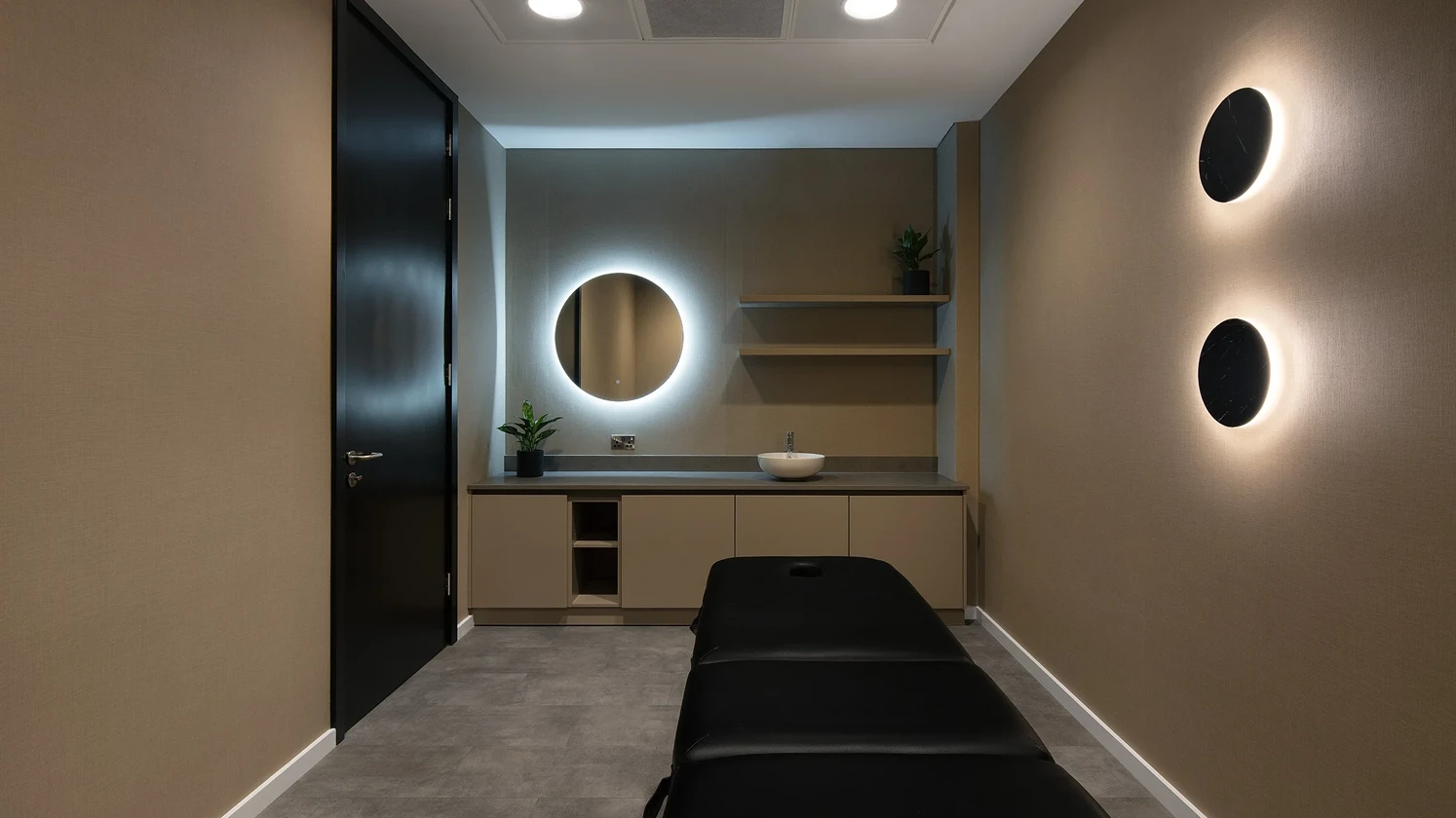 Massage table in a room with mood lighting.