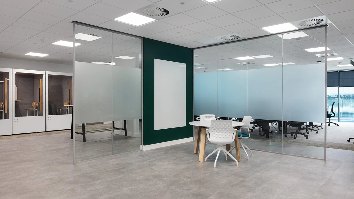 Glass walls in the centre of the floorspace creating flexible meeting rooms.