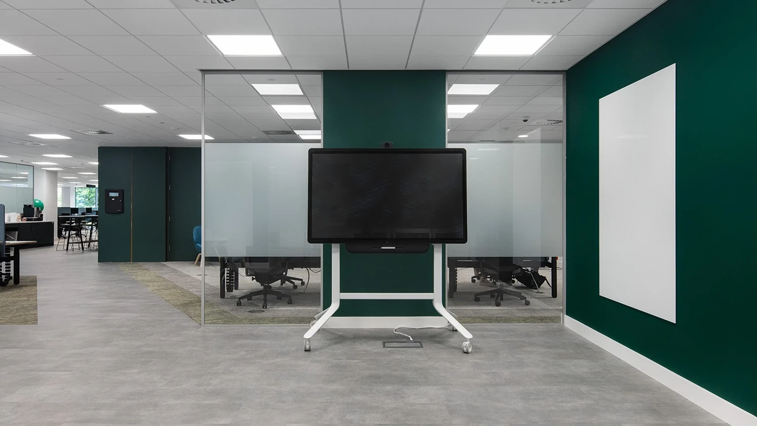 Meeting room with a moveable TV on wheels.