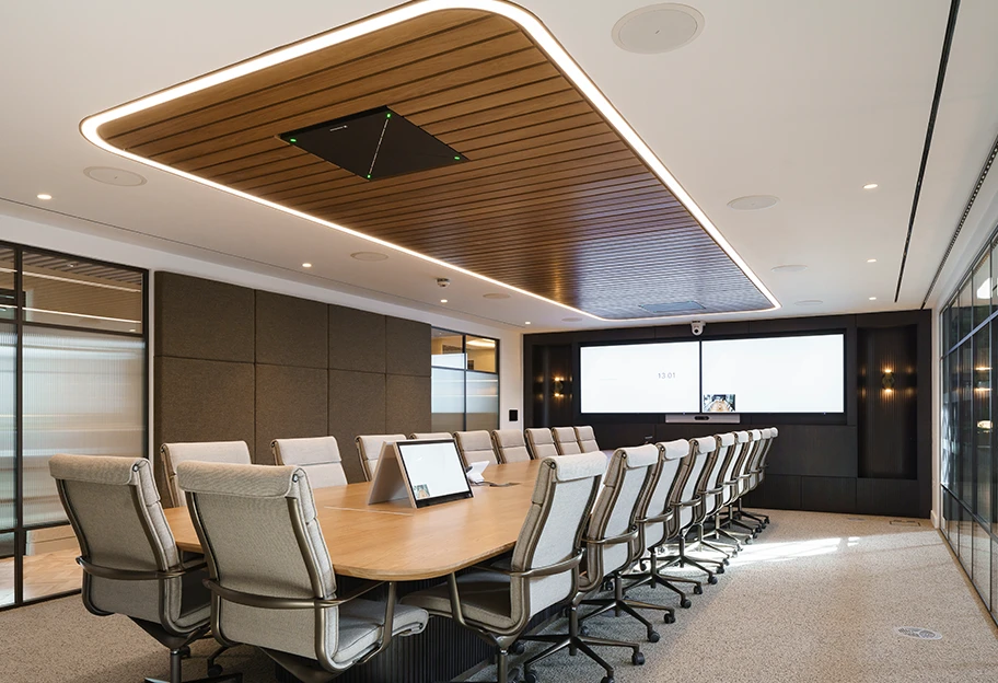 Meeting room with extra long wooden table.