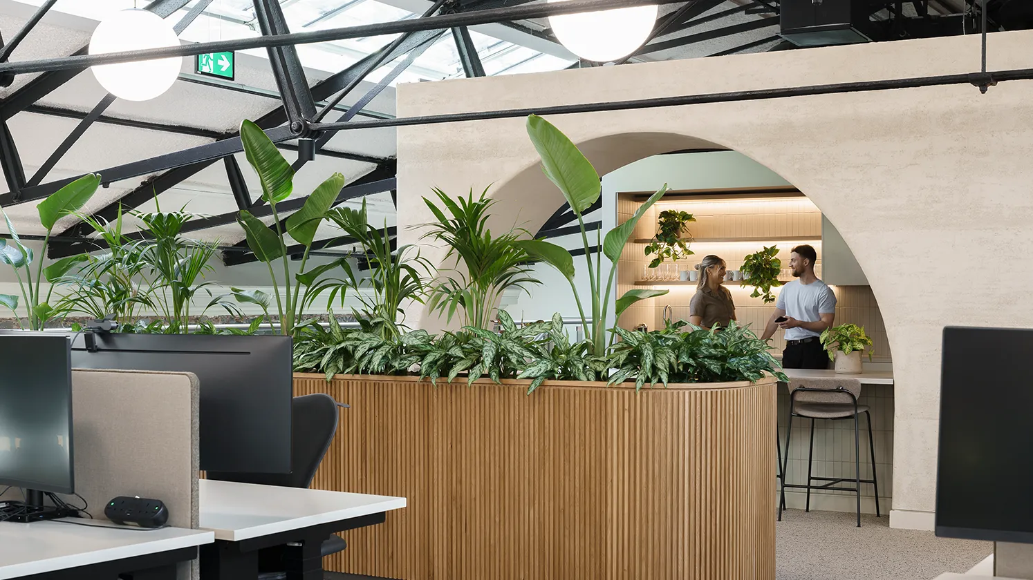 Staff talking in the kitchen.