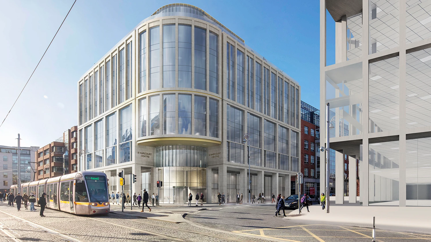 Exterior photo of building with tram stoped in front